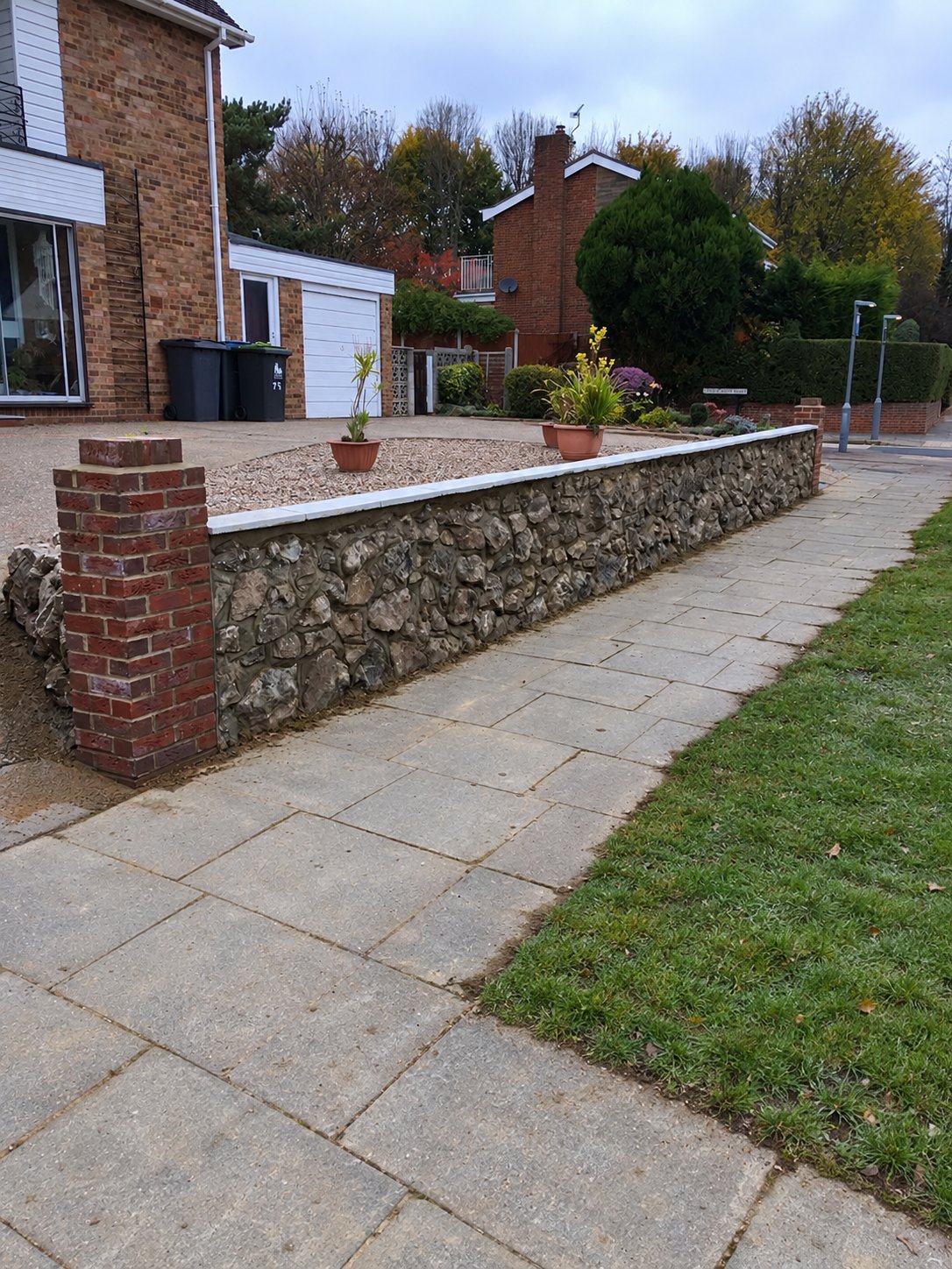 Canterbury ragstone front wall built from saved rockery stones