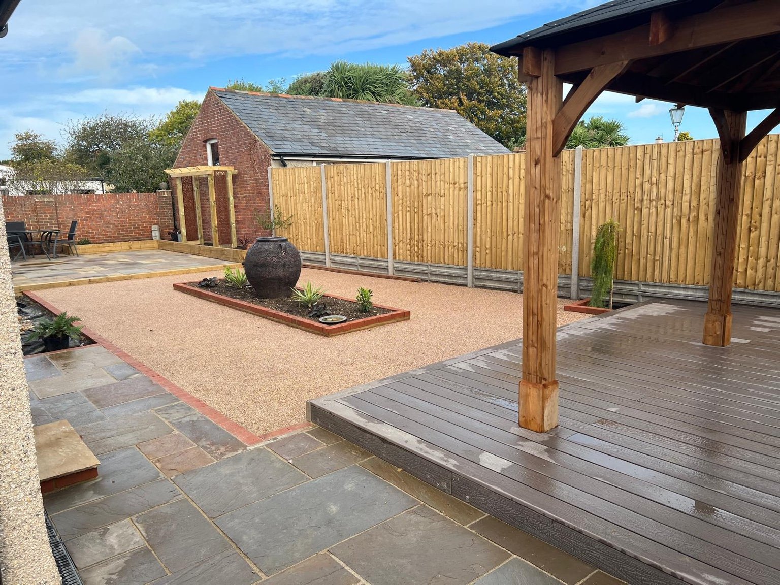 Sandstone patio, resin bound centre and composite decking in Deal
