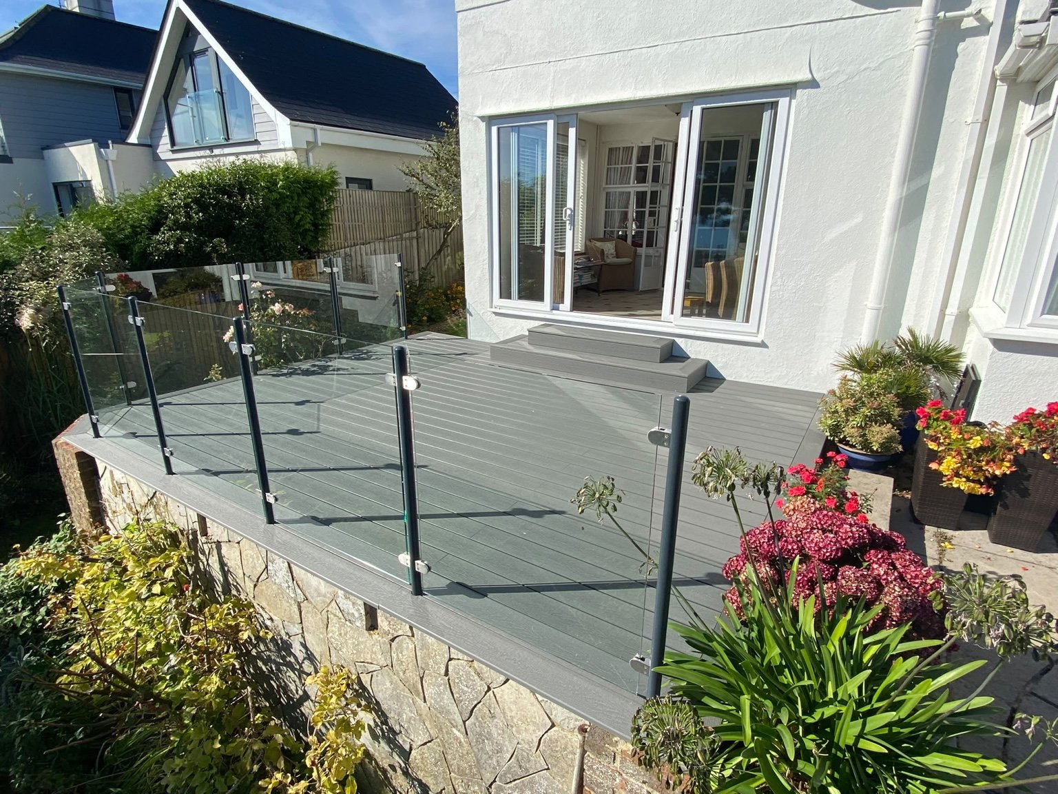 Composite decking with glass balustrade and steel posts in St Margaret’s Bay